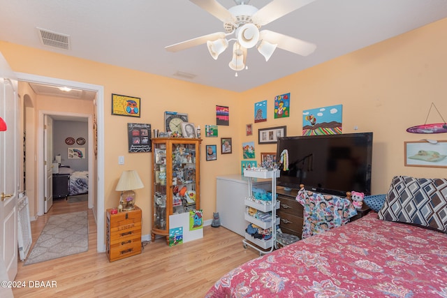 bedroom featuring ceiling fan and light hardwood / wood-style floors