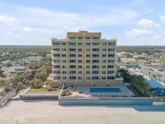 view of building exterior with a view of the beach