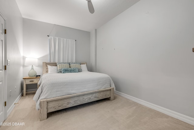 bedroom with light colored carpet and ceiling fan