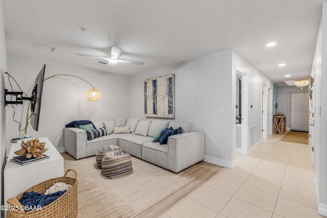 tiled living room featuring ceiling fan