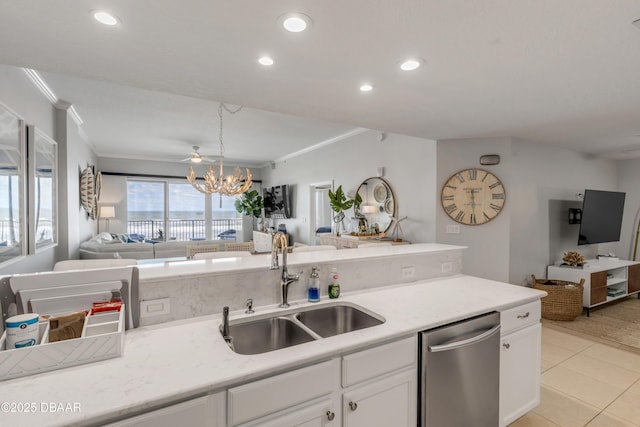 kitchen with stainless steel dishwasher, ornamental molding, sink, and white cabinets