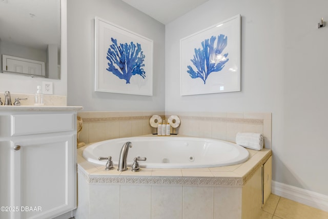 bathroom featuring vanity, tile patterned floors, and tiled bath