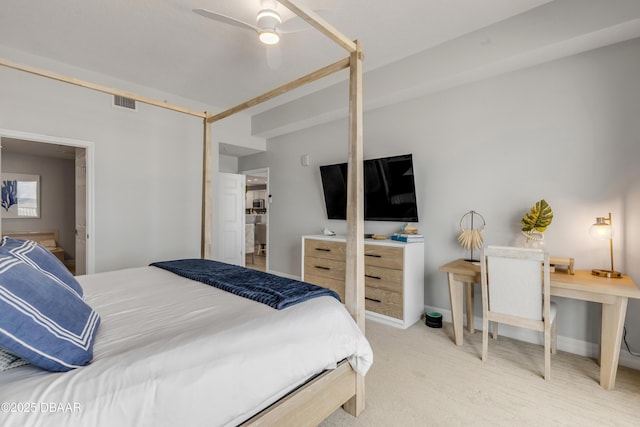 bedroom with ceiling fan and light carpet