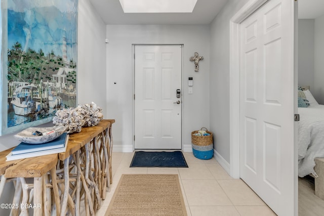 tiled foyer with a skylight