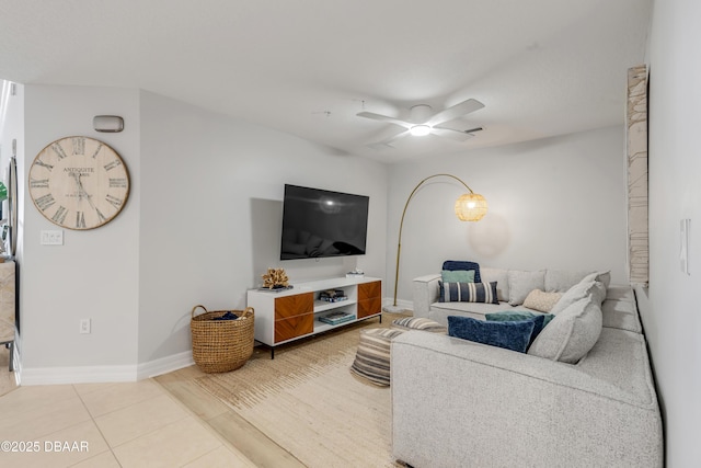 living room featuring tile patterned floors and ceiling fan