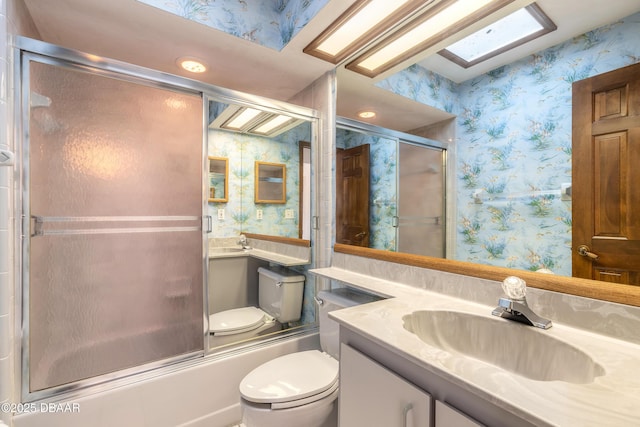 1260 Charter Oaks Cir, Holly Hill, FL 32117 - full bathroom with vanity, shower / bath combination with glass door, and toilet