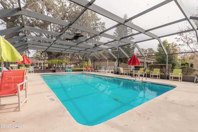 1260 Charter Oaks Cir, Holly Hill, FL 32117 - view of swimming pool featuring glass enclosure and a patio area