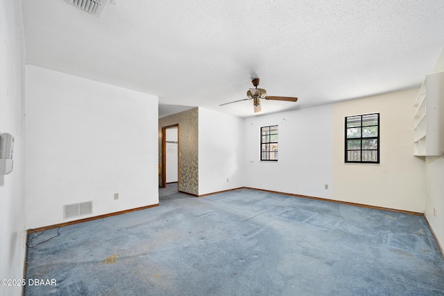 1 River Bluff Ct, Ormond Beach, FL 32174 - carpeted empty room with a ceiling fan and a textured ceiling