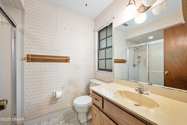 1 River Bluff Ct, Ormond Beach, FL 32174 - bathroom featuring a shower stall, vanity, wallpapered walls, and tile patterned flooring