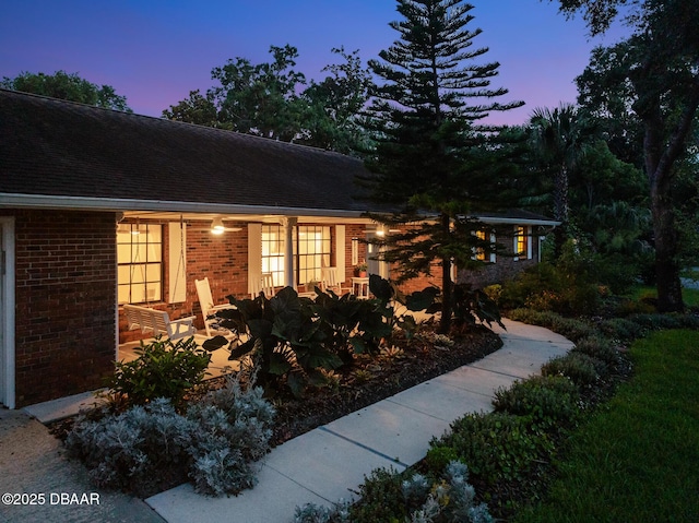 1 River Bluff Ct, Ormond Beach, FL 32174 - view of front of house with brick siding and a patio area