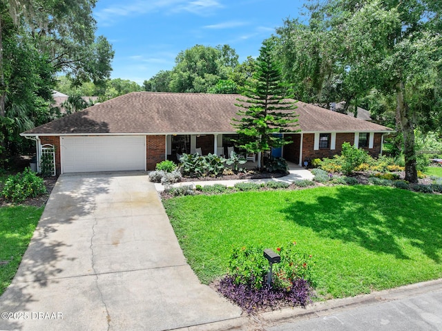 1 River Bluff Ct, Ormond Beach, FL 32174 - single story home with concrete driveway, an attached garage, brick siding, a front lawn, and a shingled roof