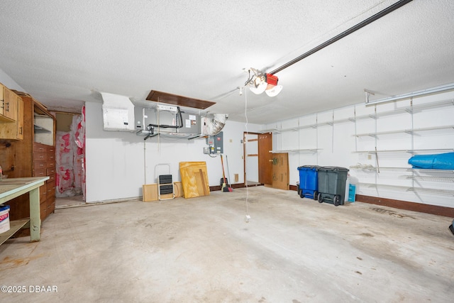 1 River Bluff Ct, Ormond Beach, FL 32174 - garage with electric panel and a garage door opener