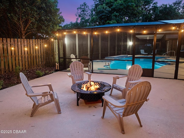 1 River Bluff Ct, Ormond Beach, FL 32174 - patio terrace at dusk with an outdoor fire pit, a patio, and a pool with connected hot tub
