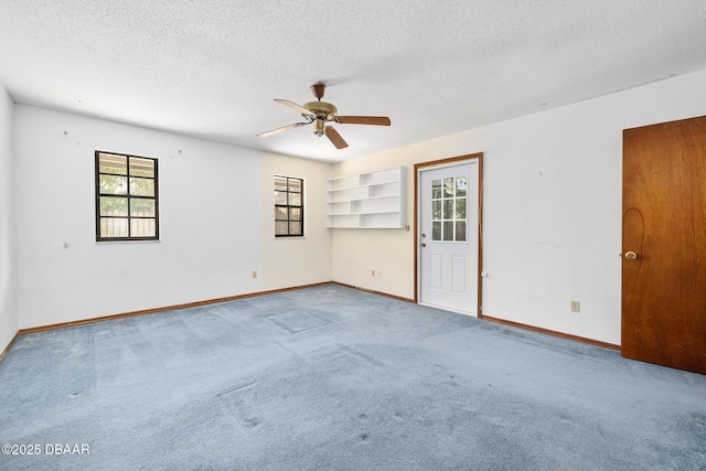 1 River Bluff Ct, Ormond Beach, FL 32174 - spare room with a ceiling fan, plenty of natural light, carpet floors, and a textured ceiling