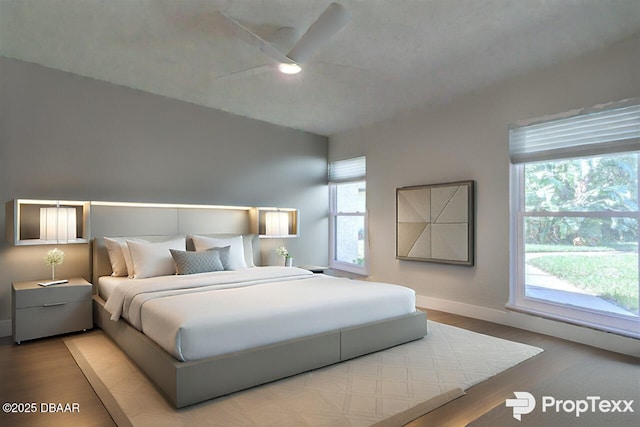 210 Sage Brush Trl, Ormond Beach, FL 32174 - bedroom with multiple windows, wood finished floors, and a ceiling fan