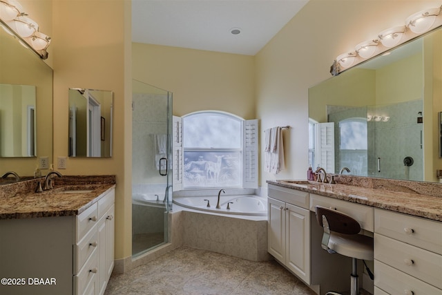 bathroom with vanity, tile patterned flooring, and shower with separate bathtub