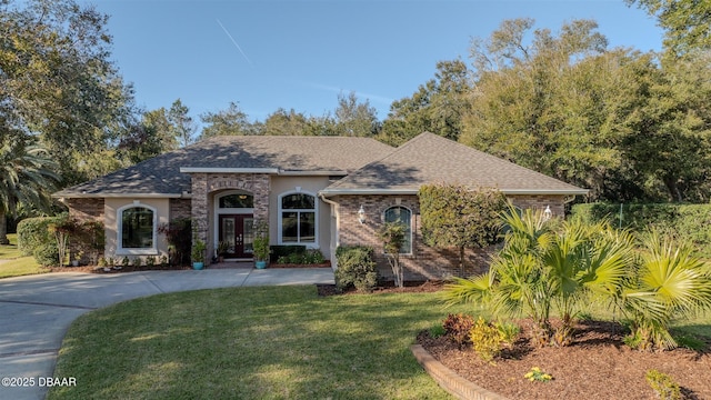 view of front of house featuring french doors and a front lawn