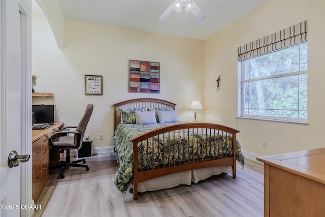 bedroom with ceiling fan and light wood-type flooring