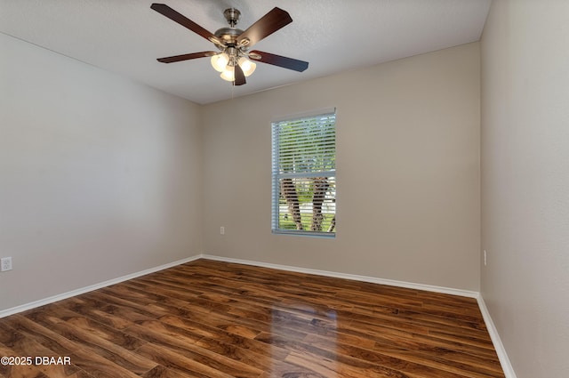 spare room with ceiling fan, dark hardwood / wood-style floors, and a textured ceiling