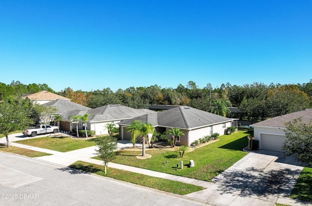 view of front of home featuring a garage and a front lawn