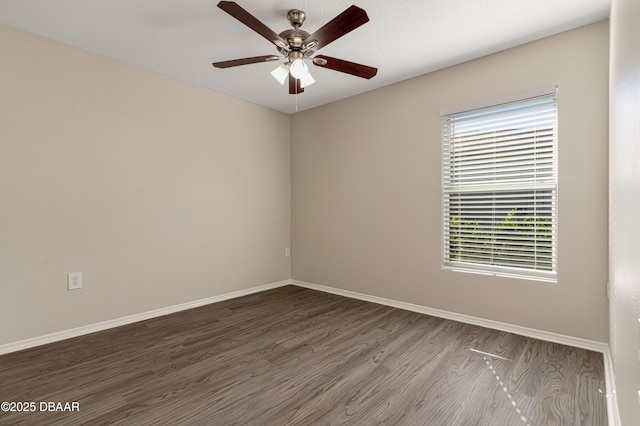 spare room with ceiling fan and wood-type flooring