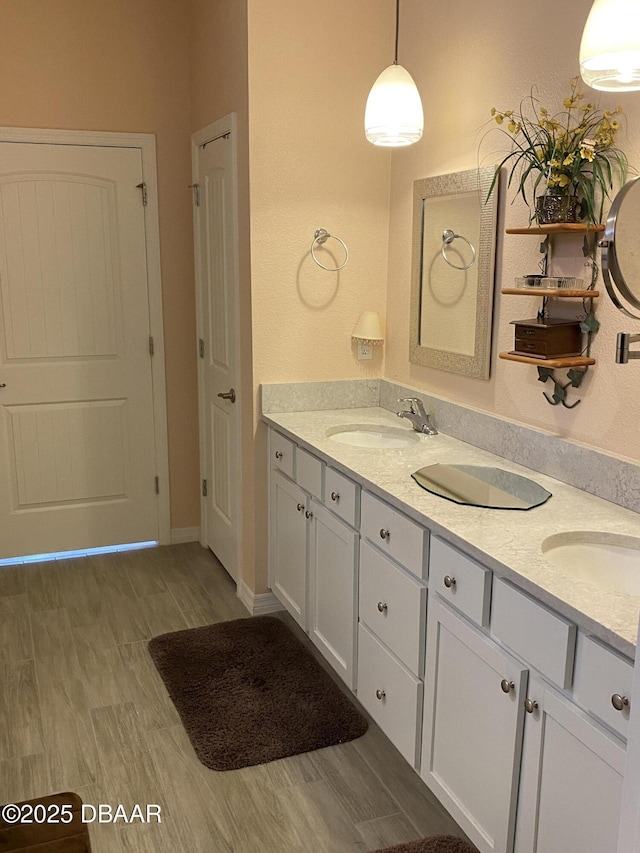 1601 Delphi Way, New Smyrna Beach, FL 32168 - bathroom featuring double vanity and wood finished floors