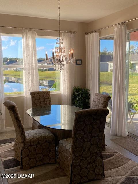 dining space with a notable chandelier