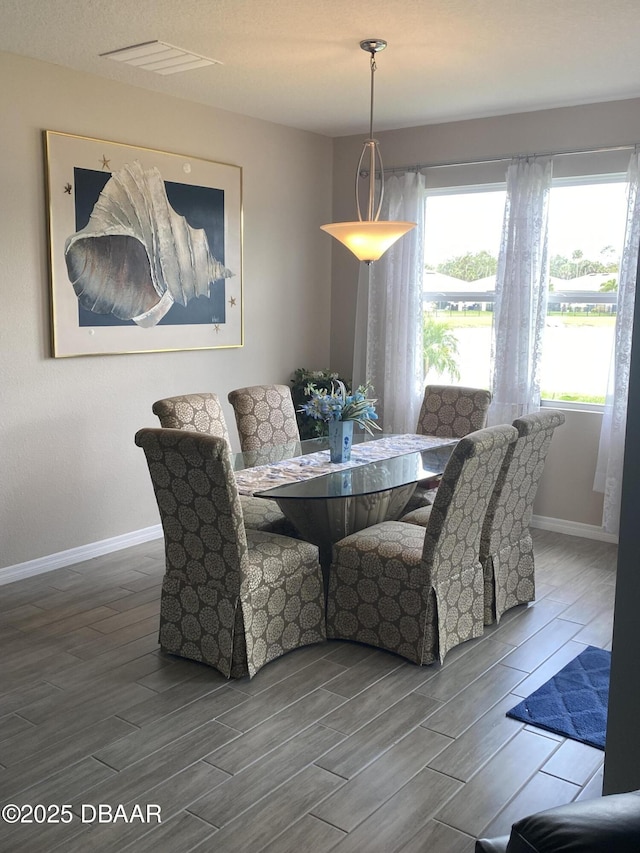 1601 Delphi Way, New Smyrna Beach, FL 32168 - dining room with wood finish floors and baseboards