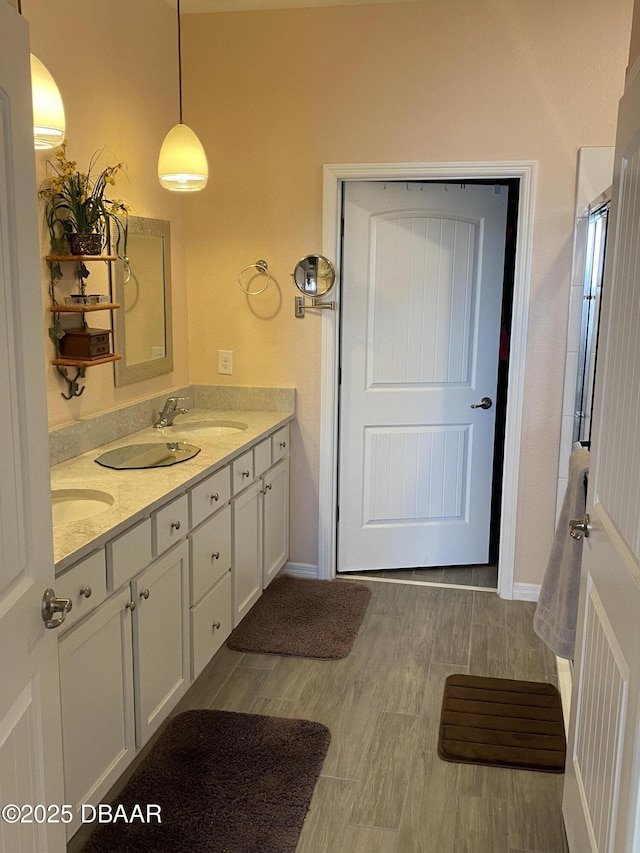1601 Delphi Way, New Smyrna Beach, FL 32168 - bathroom featuring double vanity and baseboards