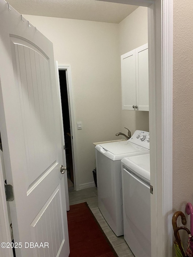 1601 Delphi Way, New Smyrna Beach, FL 32168 - laundry area featuring cabinet space and independent washer and dryer