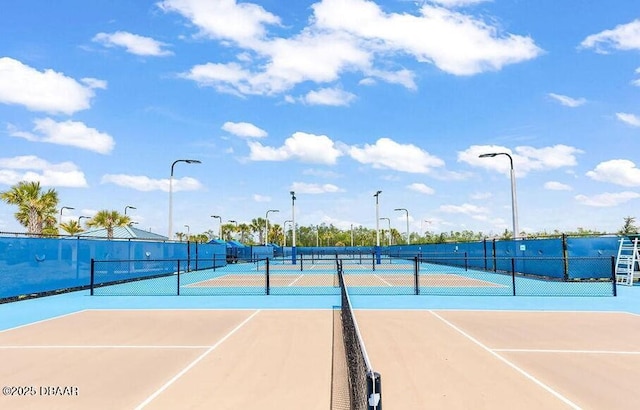 view of sport court featuring basketball hoop