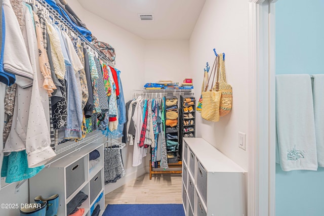 spacious closet featuring hardwood / wood-style flooring