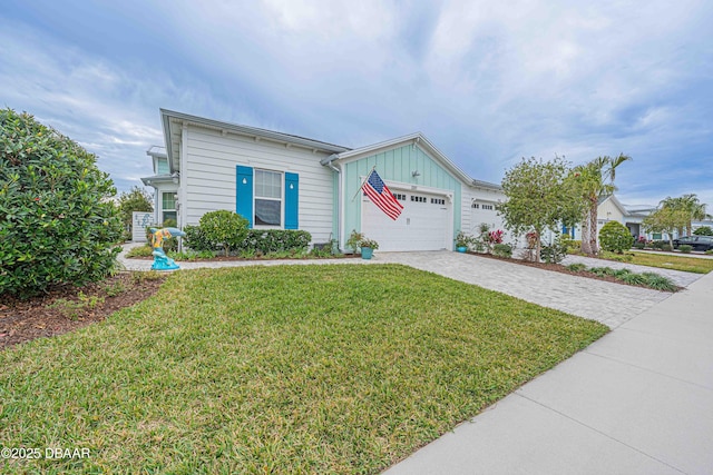 view of front of home with a garage and a front yard