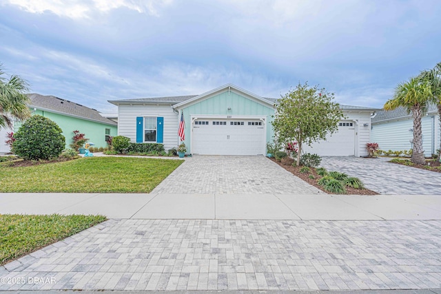 ranch-style home with a front yard and a garage