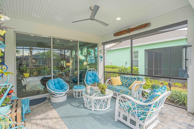 sunroom with ceiling fan and plenty of natural light