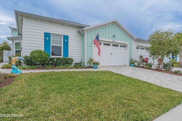 ranch-style house with a front yard and a garage