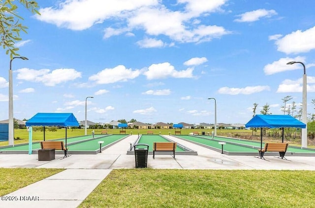 view of community featuring a yard