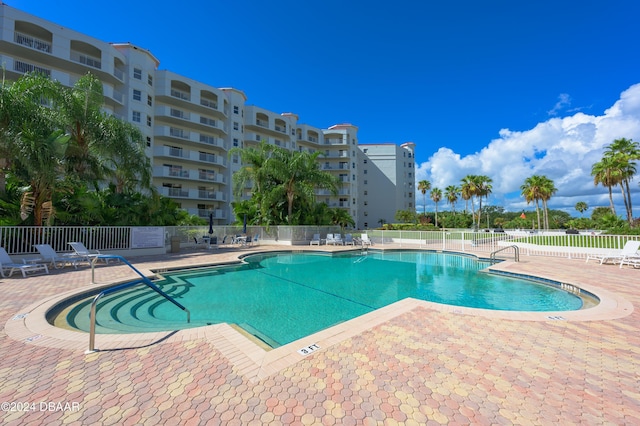 view of swimming pool with a patio area