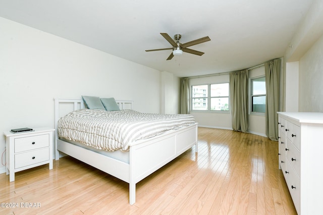 bedroom featuring light wood-type flooring and ceiling fan