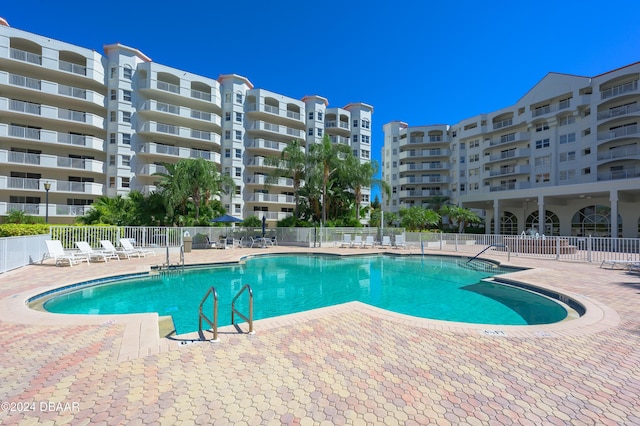 view of pool featuring a patio