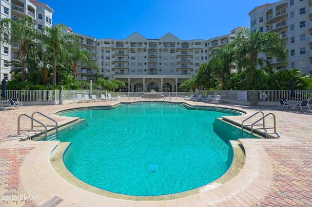 view of swimming pool with a patio