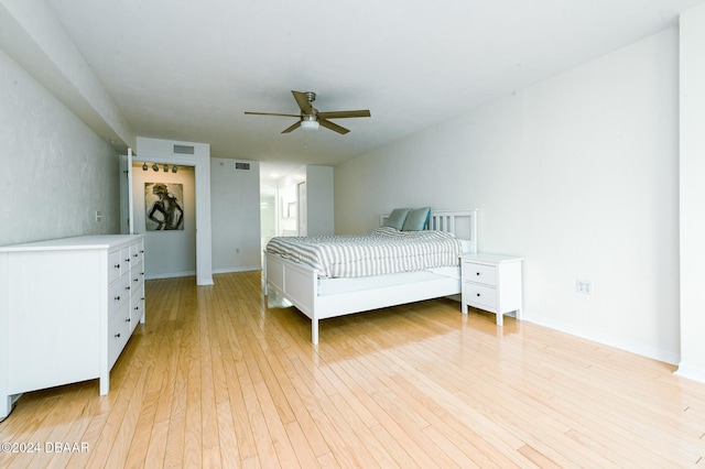 bedroom featuring ceiling fan and light hardwood / wood-style floors