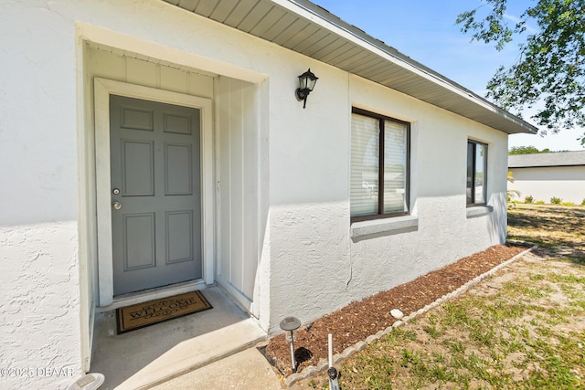1197 Stillwood Ct, Port Orange, FL 32129 - doorway to property featuring stucco siding