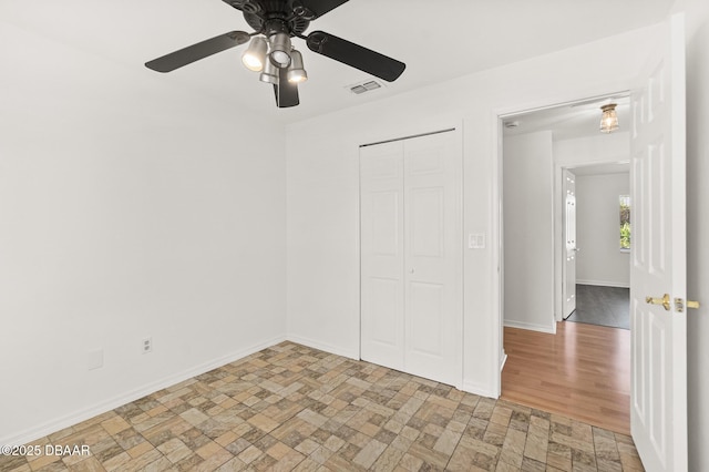 1197 Stillwood Ct, Port Orange, FL 32129 - unfurnished bedroom featuring baseboards, a ceiling fan, visible vents, and a closet