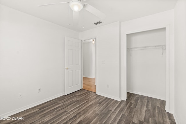 1197 Stillwood Ct, Port Orange, FL 32129 - unfurnished bedroom with dark wood finished floors, visible vents, baseboards, a ceiling fan, and a closet