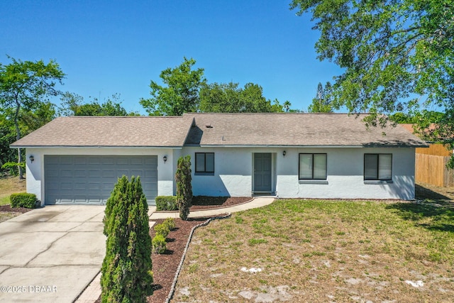 1197 Stillwood Ct, Port Orange, FL 32129 - ranch-style home featuring a front lawn, concrete driveway, fence, a garage, and stucco siding