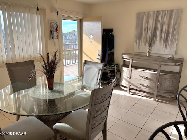 dining area featuring light tile patterned floors