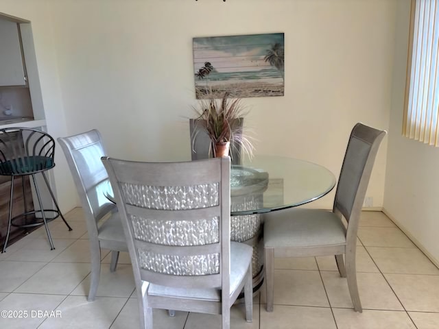 dining area with light tile patterned floors