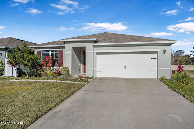 view of front facade with a garage and a front lawn