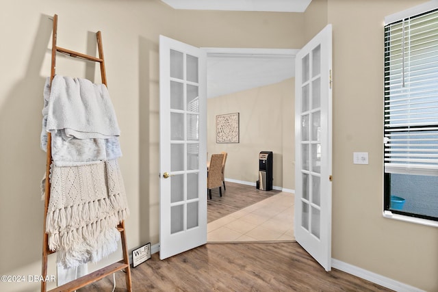 doorway to outside featuring french doors and wood-type flooring